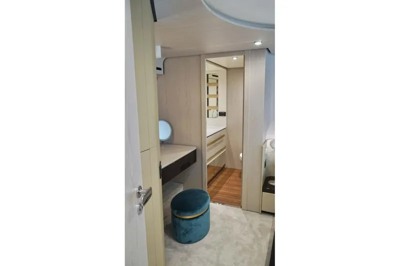 Koko Yacht Photos Pics Luxurious interior of 2023 Azimut Fly 78 yacht with modern vanity and seating.