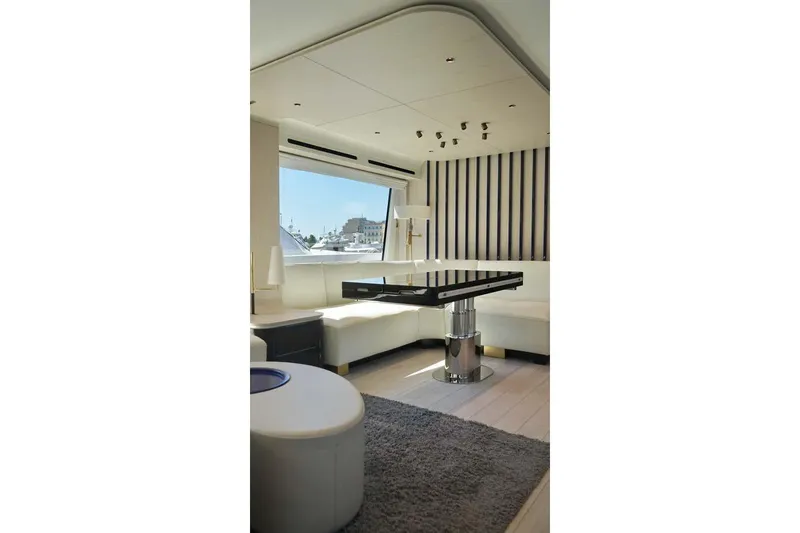 Koko Yacht Photos Pics Luxurious interior of 2023 Azimut Fly 78 yacht with modern furnishings and large window view.