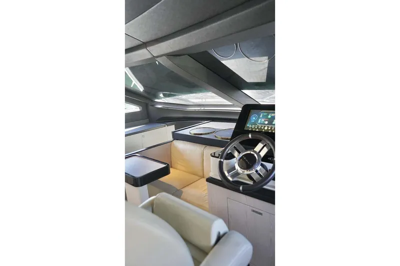 Koko Yacht Photos Pics Luxurious interior of 2023 Azimut Fly 78 yacht with modern steering and dashboard.