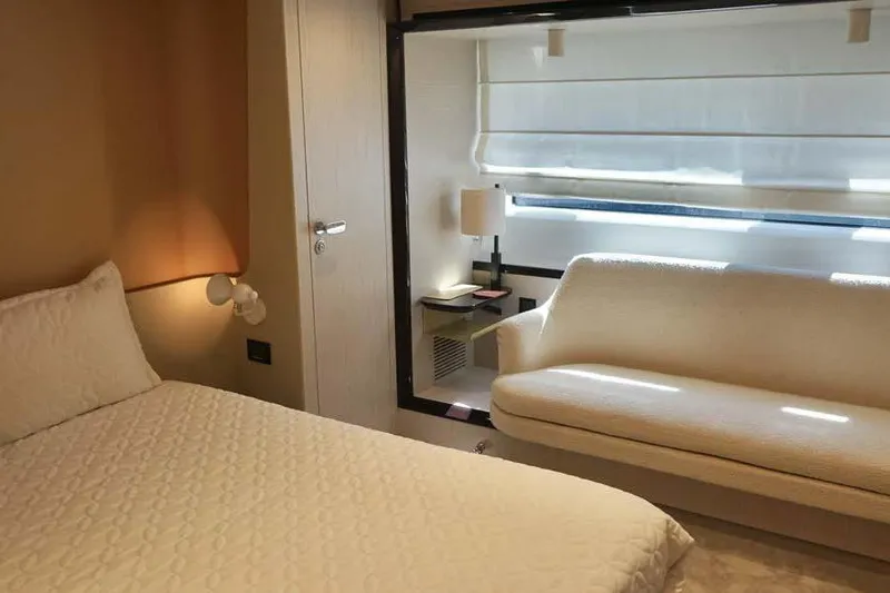 Koko Yacht Photos Pics Luxurious interior of 2023 Azimut Fly 78 yacht with elegant bedroom and seating area.