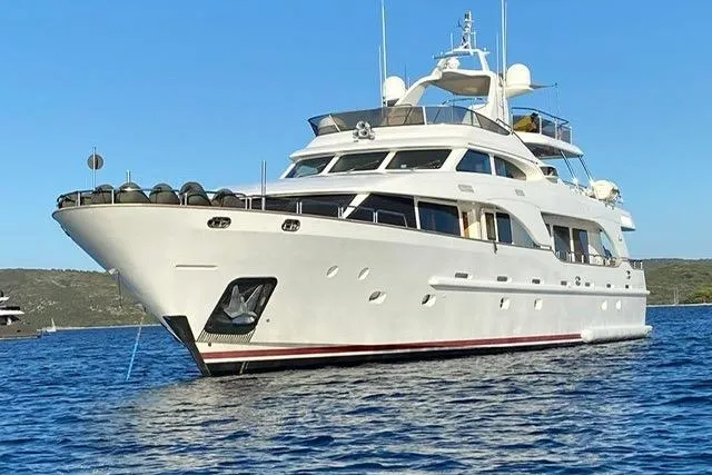  Yacht Photos Pics Luxury 2004 Benetti Tradition 100 yacht on serene blue waters.