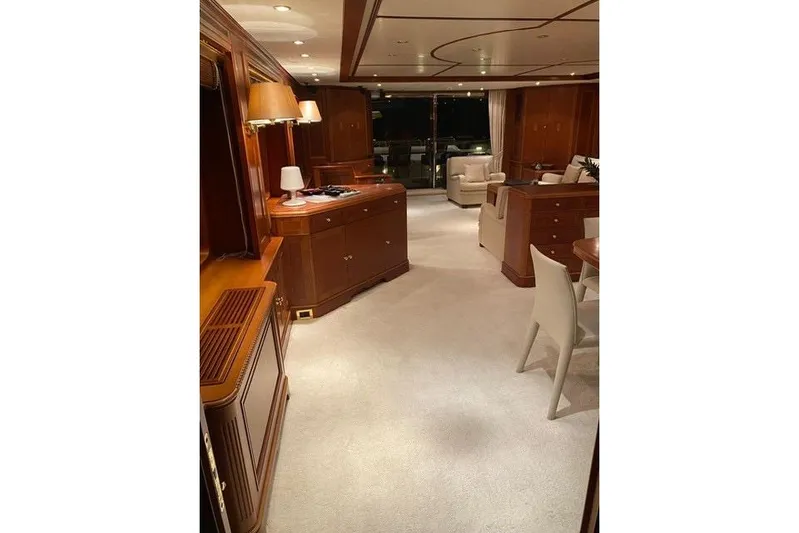  Yacht Photos Pics Luxurious interior of 2004 Benetti Tradition 100 yacht with elegant wood furnishings.