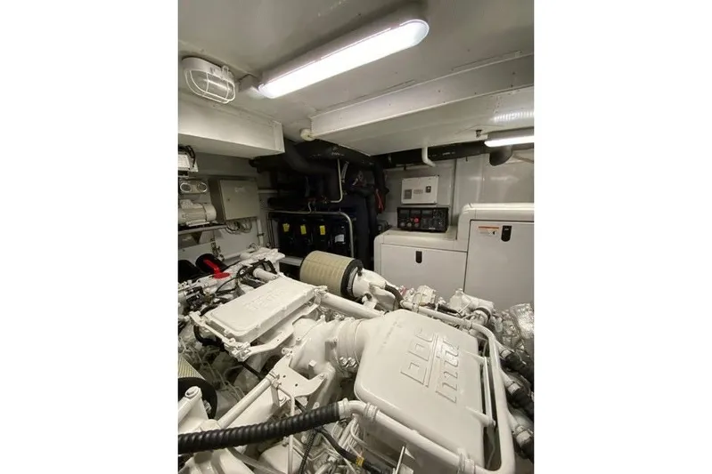  Yacht Photos Pics Engine room of 2004 Benetti Tradition 100 yacht, featuring mechanical components and control panels.