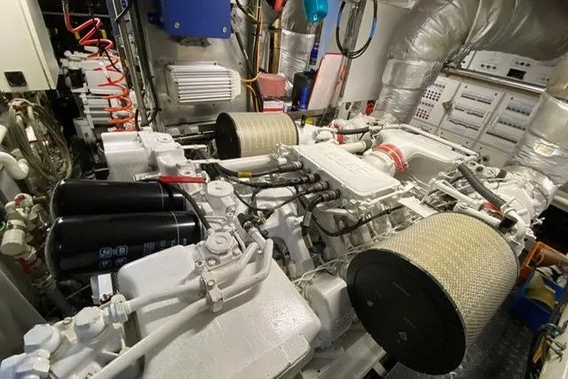  Yacht Photos Pics Engine room of a 2004 Benetti Tradition 100 yacht, showcasing mechanical components and systems.