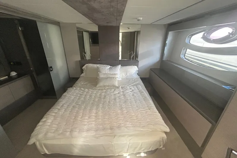 Habeas Orcas Yacht Photos Pics Luxurious bedroom interior of a 2020 Pershing 62 yacht, featuring modern design and elegant furnishings.