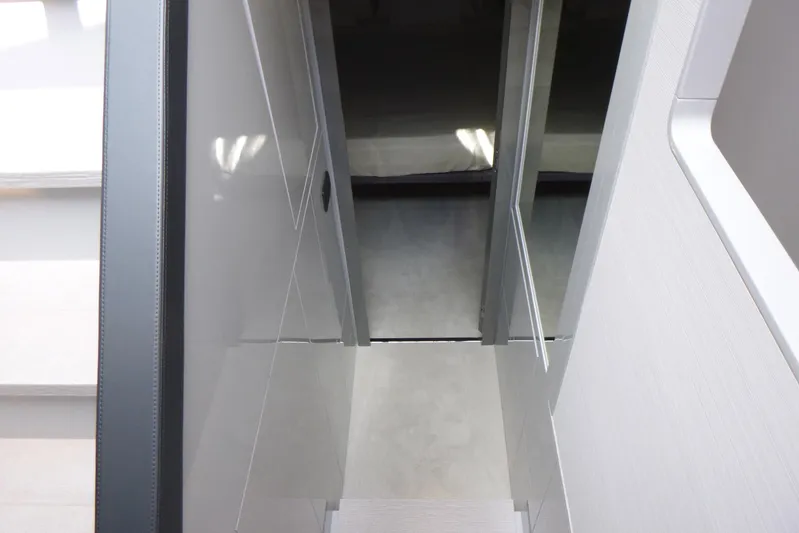 Habeas Orcas Yacht Photos Pics Interior view of 2020 Pershing 62 yacht, featuring sleek modern design and glossy surfaces.