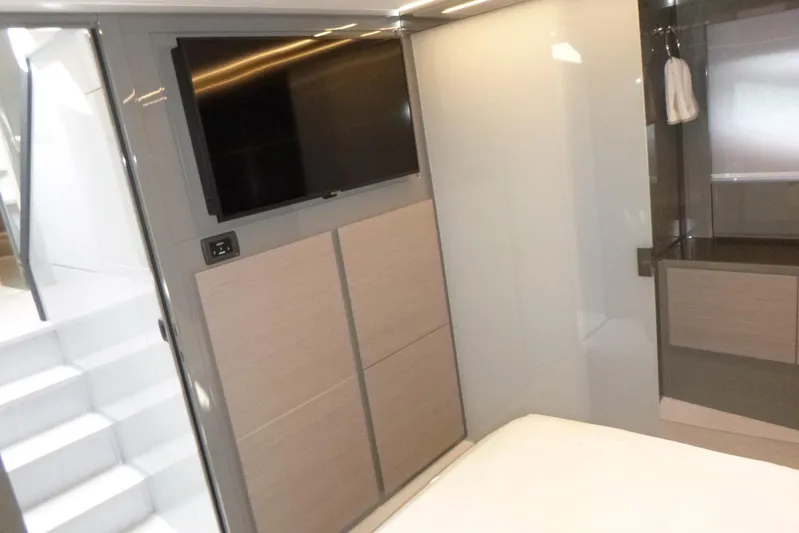 Habeas Orcas Yacht Photos Pics Modern interior of 2020 Pershing 62 yacht with TV and sleek design.