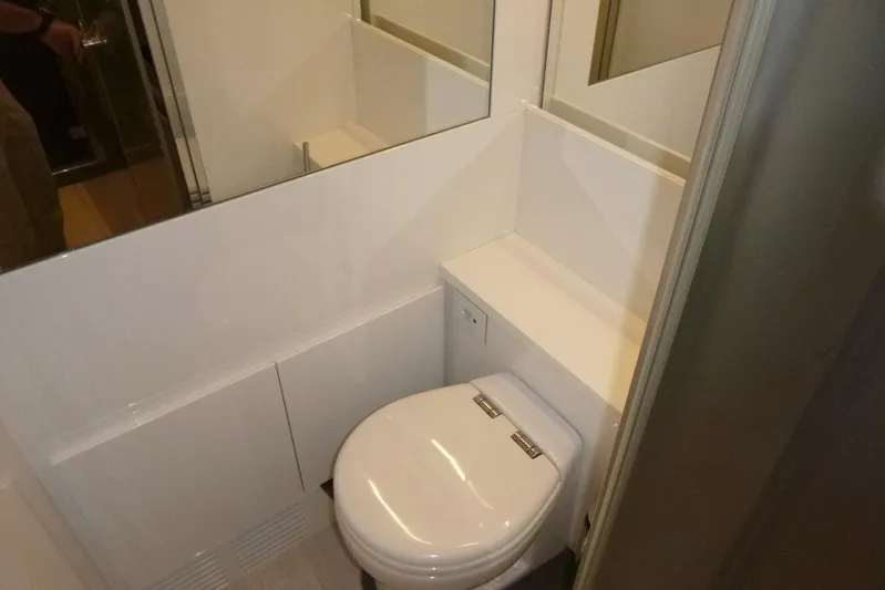 Habeas Orcas Yacht Photos Pics Modern bathroom interior on a 2020 Pershing 62 yacht, featuring sleek design and compact layout.