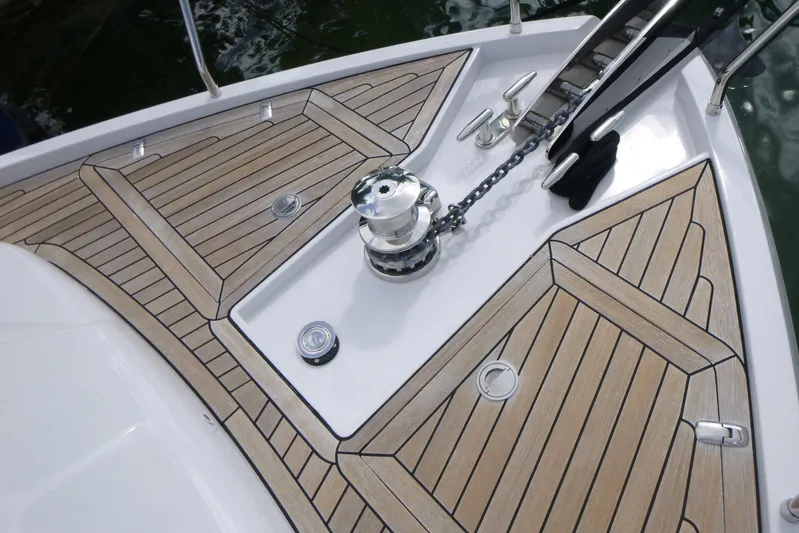 Habeas Orcas Yacht Photos Pics Deck of 2020 Pershing 62 yacht with wooden finish and anchor chain.