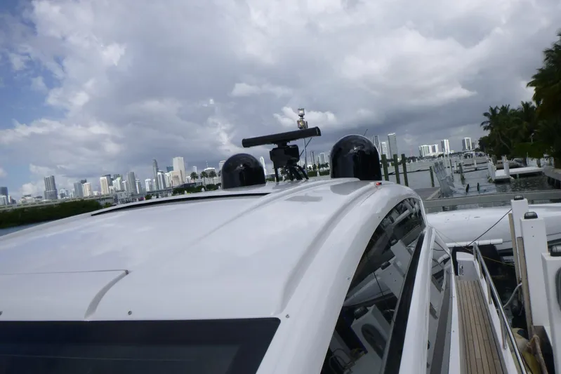 Habeas Orcas Yacht Photos Pics Luxury Pershing 62 yacht docked with city skyline in the background, 2020 model.