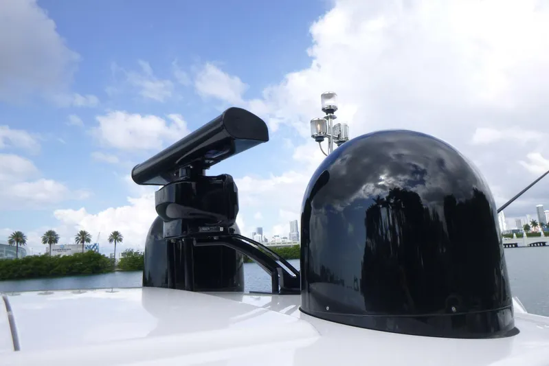 Habeas Orcas Yacht Photos Pics Radar and satellite equipment on a 2020 Pershing 62 yacht under a blue sky.