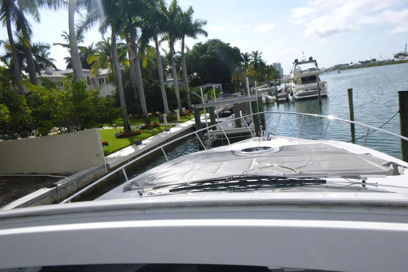 Habeas Orcas Yacht Photos Pics 2020 Pershing 62 yacht docked by palm-lined waterfront.