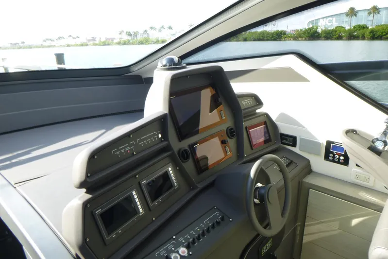 Habeas Orcas Yacht Photos Pics Cockpit of 2020 Pershing 62 yacht with advanced navigation controls and steering wheel.