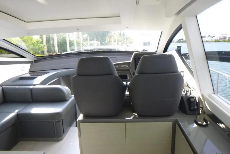 Habeas Orcas Yacht Photos Pics Interior of 2020 Pershing 62 yacht with modern seating and dashboard view.