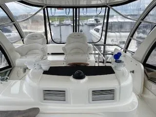  Yacht Photos Pics 2007 Sea Ray 52 Sedan Bridge yacht interior with helm and seating area.