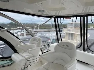  Yacht Photos Pics Interior of 2007 Sea Ray 52 Sedan Bridge yacht with plush seating and panoramic windows.