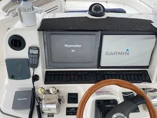  Yacht Photos Pics 2007 Sea Ray 52 Sedan Bridge helm with Raymarine and Garmin navigation systems.
