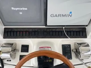  Yacht Photos Pics 2007 Sea Ray 52 Sedan Bridge helm with Raymarine and Garmin navigation systems.