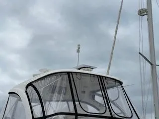  Yacht Photos Pics 2007 Sea Ray 52 Sedan Bridge yacht with enclosed flybridge under cloudy skies.