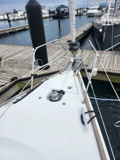 Vilia Yacht Photos Pics Bow of 2010 Jeanneau 45DS sailboat docked at marina.