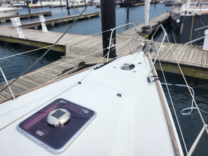 Vilia Yacht Photos Pics Sailboat Jeanneau 45DS 2010 docked at marina, showing deck and rigging.