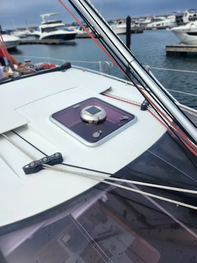 Vilia Yacht Photos Pics 2010 Jeanneau 45DS sailboat deck with hatch and rigging, docked at marina.