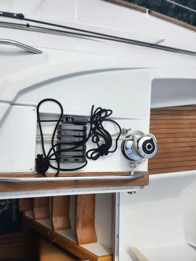 Vilia Yacht Photos Pics Sailing equipment on a 2010 Jeanneau 45DS yacht, featuring ropes and winch.