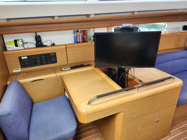 Vilia Yacht Photos Pics Interior of 2010 Jeanneau 45DS yacht with navigation station and monitor.