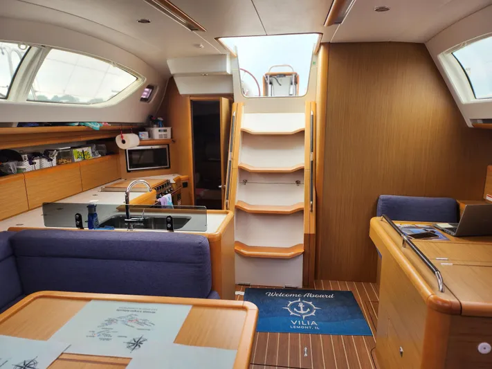 Vilia Yacht Photos Pics Interior of 2010 Jeanneau 45DS yacht with modern kitchen and seating area.