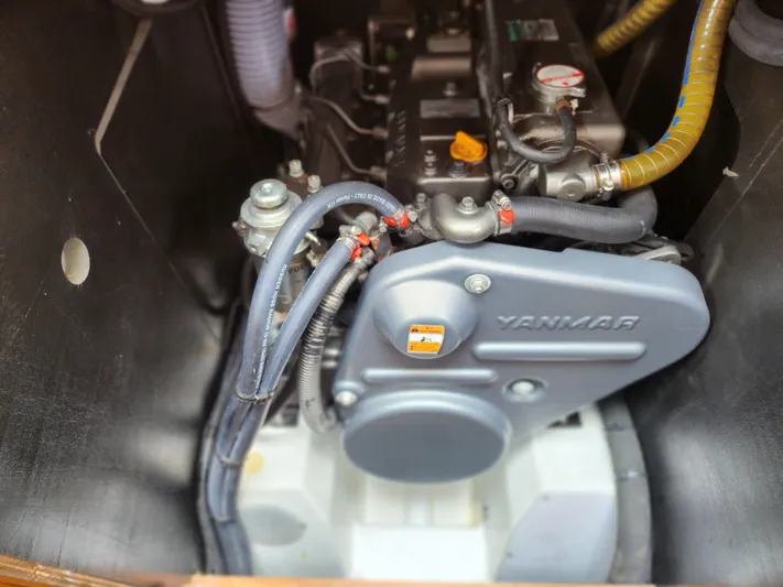 Vilia Yacht Photos Pics Engine compartment of a 2010 Jeanneau 45DS sailboat featuring a Yanmar engine.