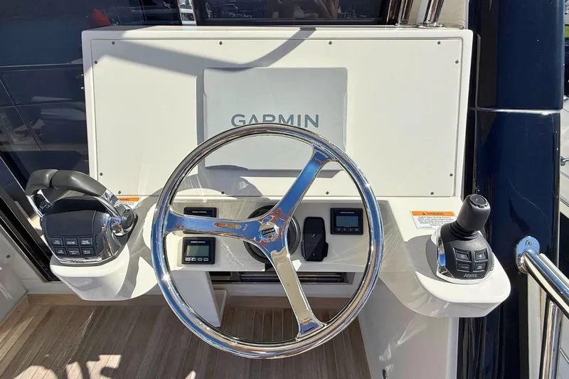 Buzz Yacht Photos Pics Steering console of 2020 Riviera 57 Enclosed Flybridge with Garmin navigation system.