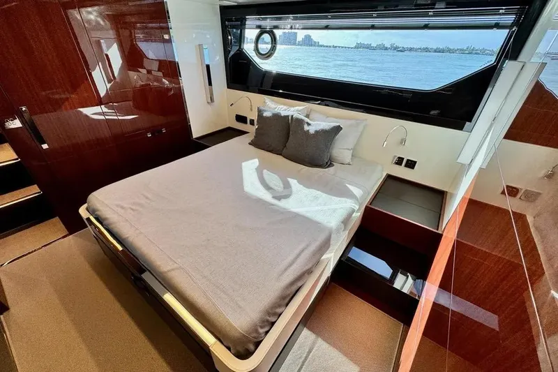  Yacht Photos Pics Luxurious bedroom interior of 2021 Riva 56' Rivale yacht with waterfront view.