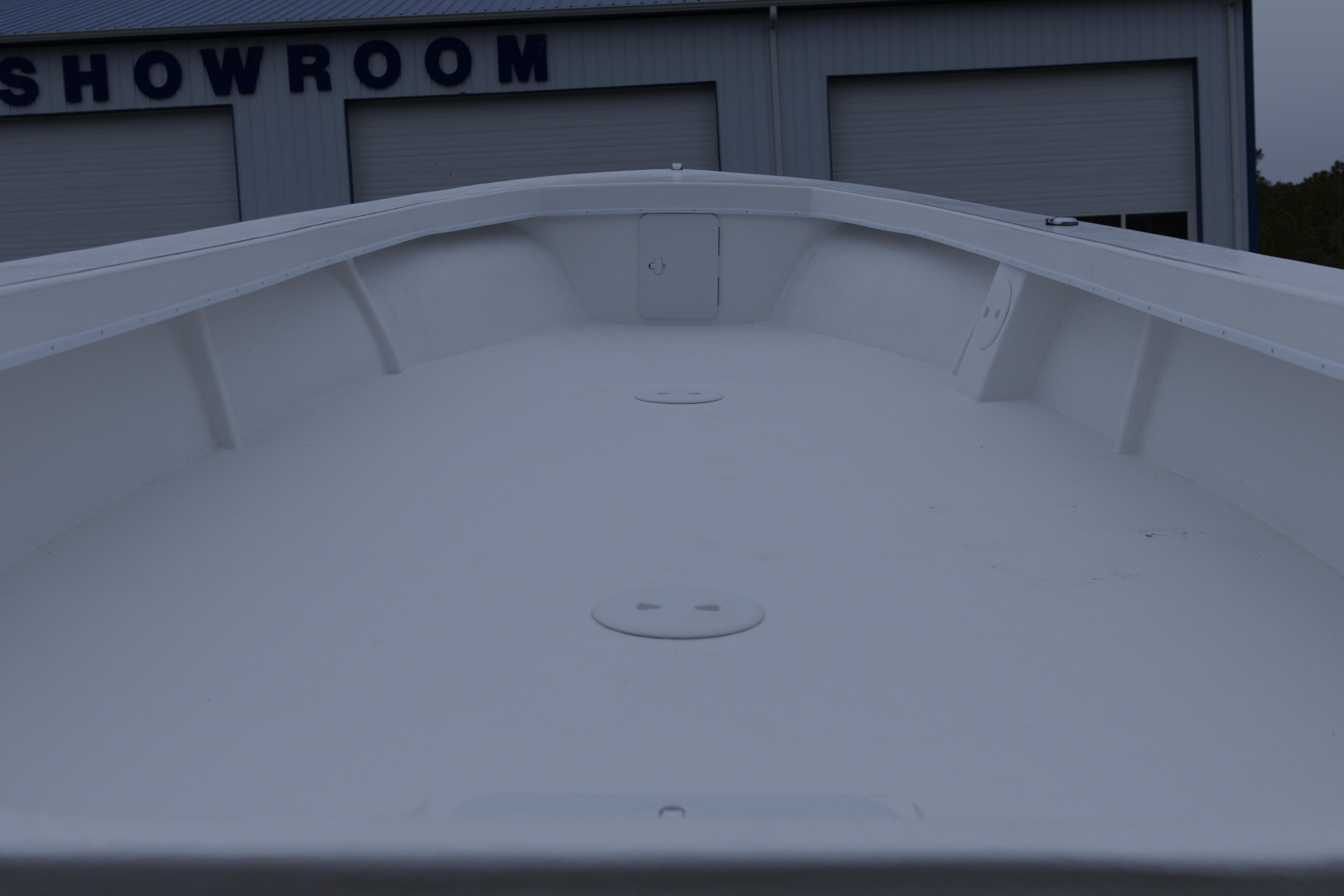 2026 C-Hawk 23 Commercial boat interior, showcased in a showroom setting.