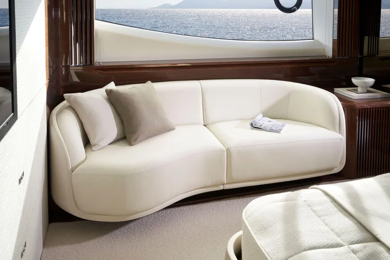  Yacht Photos Pics Luxurious interior of 2025 Princess X80 yacht with elegant white sofa and sea view.