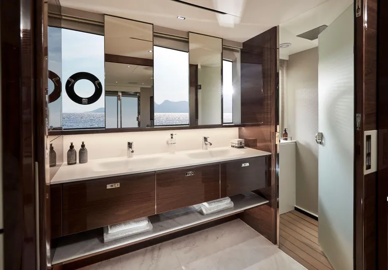  Yacht Photos Pics Luxurious bathroom on 2025 Princess X80 yacht with ocean view and modern fixtures.