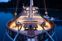 Luxurious 2003 Aganlar Custom Motorsailer Gulet with elegant deck lighting at dusk.