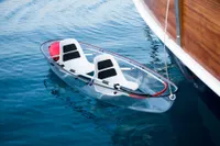 Clear kayak with two seats beside Aganlar Custom Motorsailer Gulet, 2003, on calm blue water.