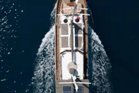 Aerial view of 2003 Aganlar Custom Motorsailer Gulet sailing on deep blue water.
