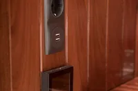 Wood-paneled interior of 2003 Aganlar Custom Motorsailer Gulet with modern electrical outlets.