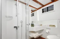 Luxurious bathroom on 2003 Aganlar Custom Motorsailer Gulet with modern fixtures and wooden accents.