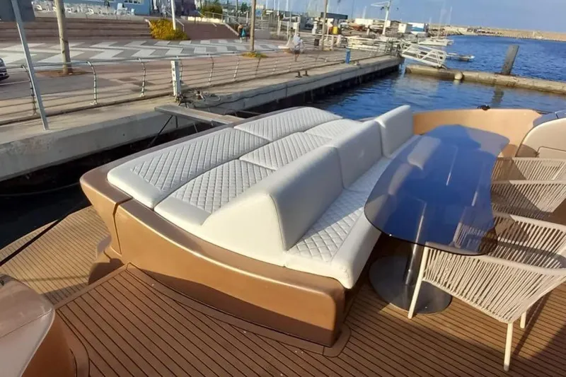  Yacht Photos Pics Luxury yacht deck with white cushioned seating and glass table, AB 88 model, 2005.