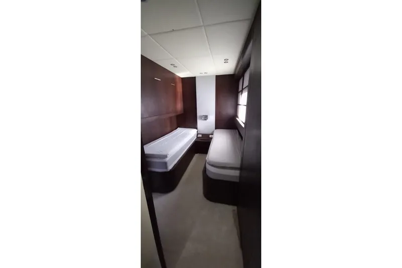  Yacht Photos Pics Compact cabin interior with twin beds in AB 88, 2005 model yacht.