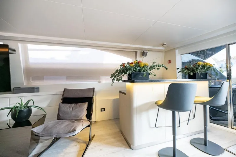 Eva Yacht Photos Pics Luxurious interior of 2009 Tecnomar Velvet 36 EVA yacht with modern seating and floral decor.