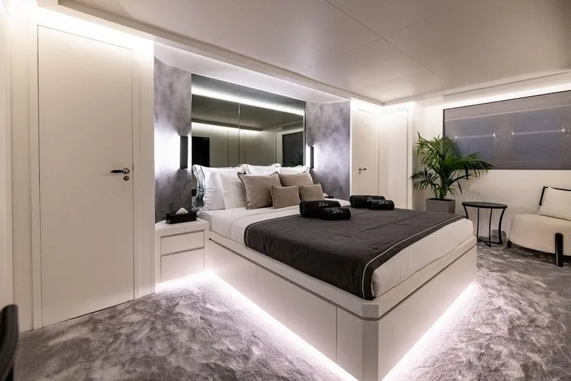 Eva Yacht Photos Pics Luxurious bedroom interior on Tecnomar Velvet 36 EVA yacht, featuring modern design and ambient lighting.