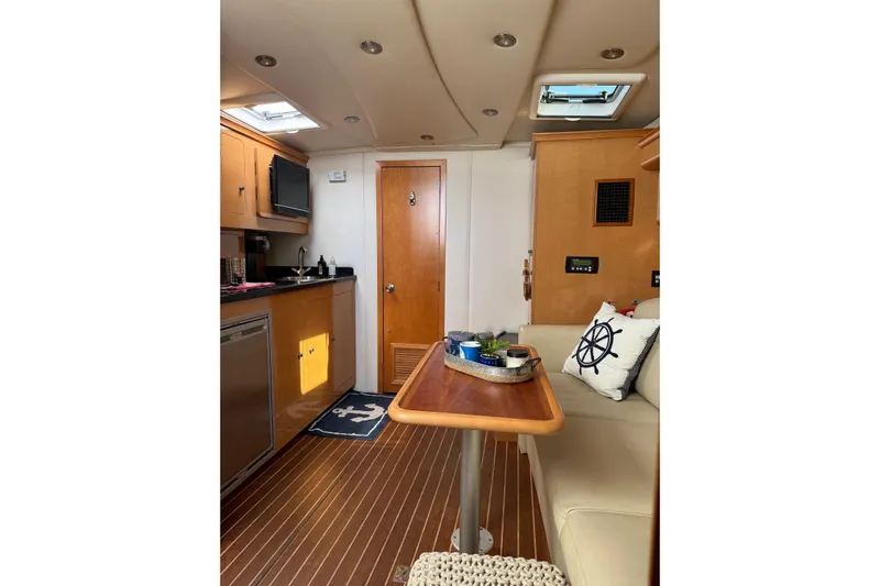 Yacht Photos Pics Interior of 2010 Rinker 400 Express Cruiser with cozy seating and modern amenities.
