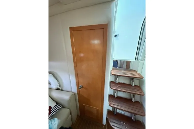  Yacht Photos Pics Interior of 2010 Rinker 400 Express Cruiser with wooden door and stairs.