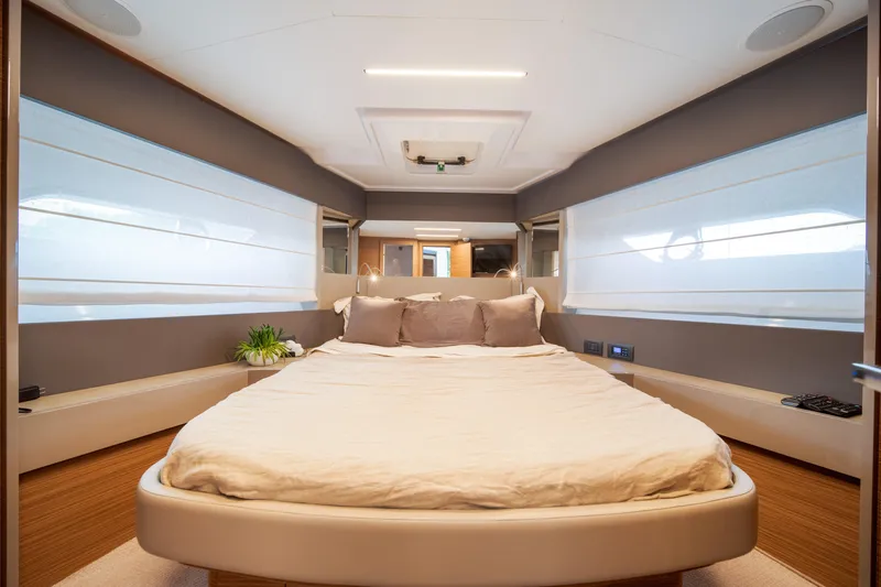 Yacht Photos Pics Luxurious bedroom interior of 2018 Ferretti Yachts 450 fly, featuring modern design and comfort.