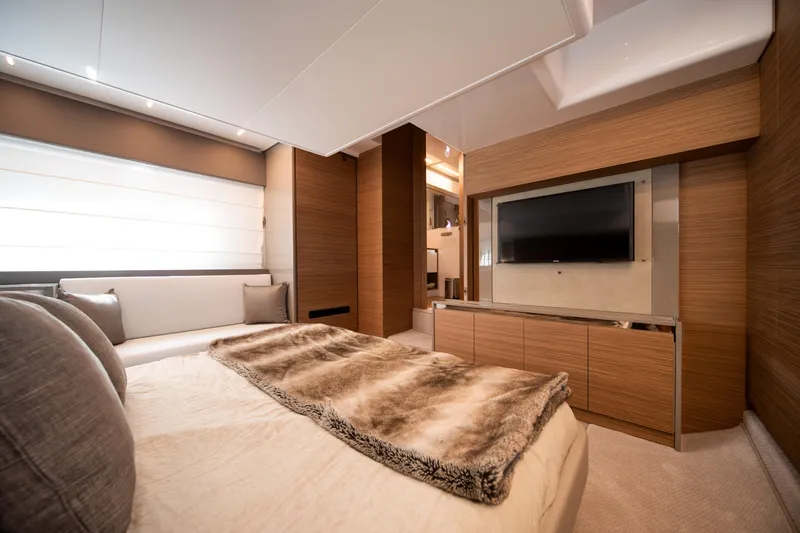  Yacht Photos Pics Luxurious bedroom interior of 2018 Ferretti Yachts 450 fly with modern decor and TV.