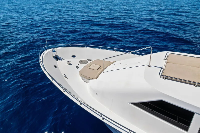 Bravo Zulu Yacht Photos Pics Luxurious 1997 Westship Raised Pilothouse Motor Yacht on serene blue ocean waters.