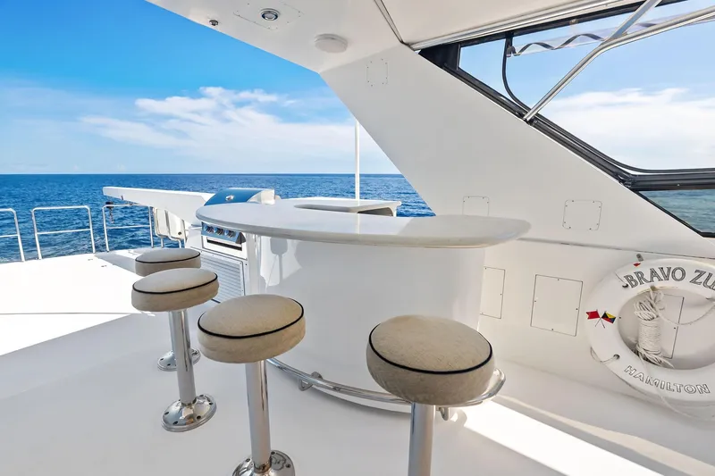 Bravo Zulu Yacht Photos Pics Luxurious 1997 Westship Raised Pilothouse Motor Yacht with elegant outdoor bar and ocean view.